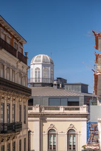 a building with a dome on top of it at Boutique Chiado Suites in Lisbon