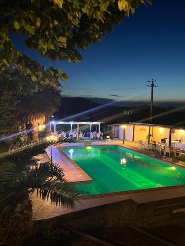 a swimming pool at night with lights on at Al Settimo Cielo in Montenero di Bisaccia