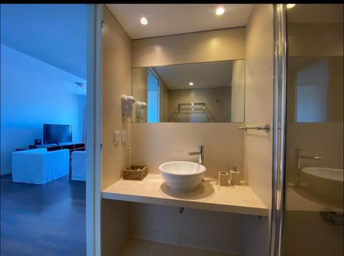 a bathroom with a sink and a mirror at Depto Quartier San Telmo in Buenos Aires