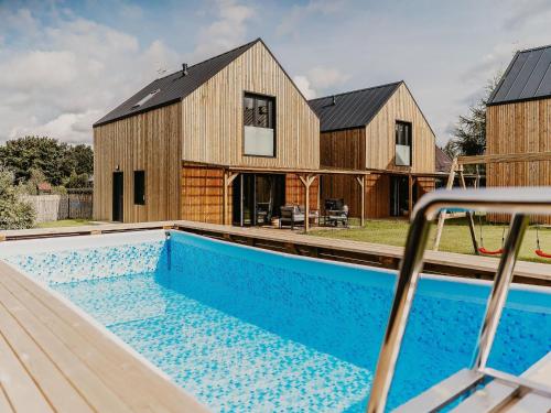 Holiday Home by Lake arnowieckie with Jacuzzi