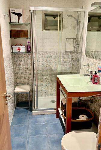 a bathroom with a shower and a sink at Portosin Sea&Pool in Portosin