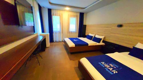 Ένα ή περισσότερα κρεβάτια σε δωμάτιο στο Kibar Suite Hotel