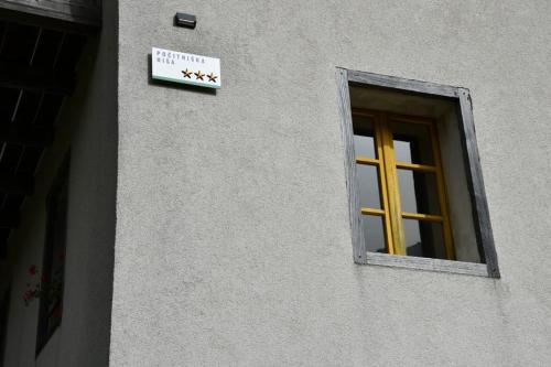 a window on a building with a sign on it at Apartment Abinkar in Tolmin