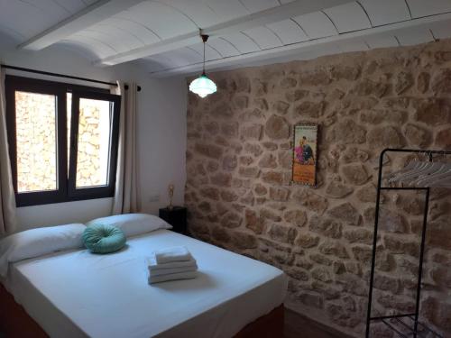 Postel nebo postele na pokoji v ubytování Casa Don Pelayo Boutique Apartments & Café