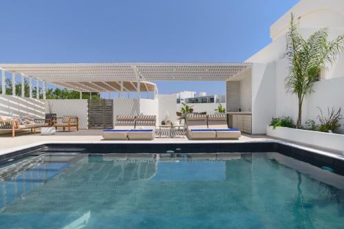 an image of a swimming pool in a house at Mylos Luxury Escape Villa in Faliraki