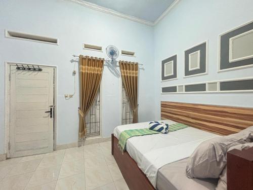 Ένα ή περισσότερα κρεβάτια σε δωμάτιο στο Banera Gili Homestay