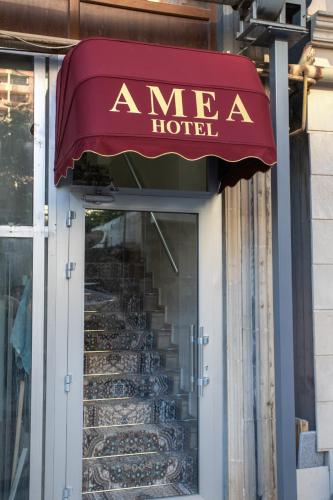 a store front with a mea hotel sign and stairs at Amea Baku Hotel in Baku