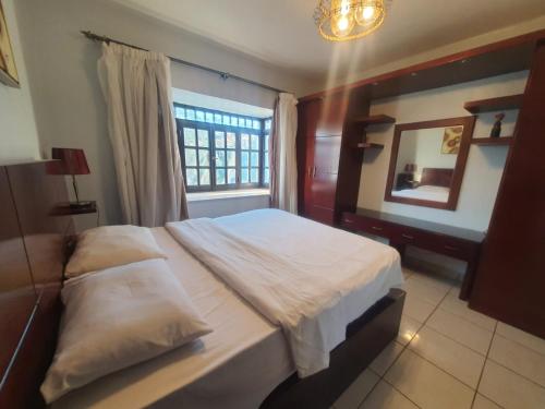 Ένα ή περισσότερα κρεβάτια σε δωμάτιο στο deltasharm resort