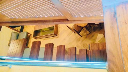 an overhead view of a wooden staircase in a building at Le Magnifique in Porvorim