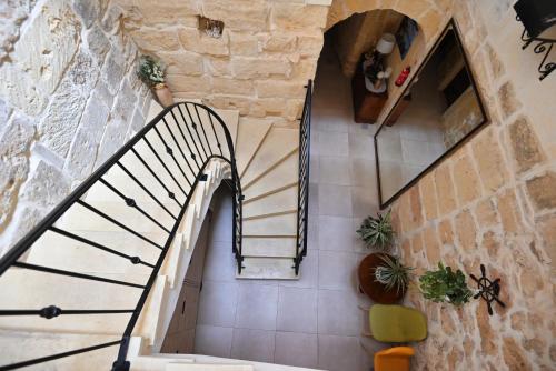 an overhead view of a staircase in a building at The Cloisters Bed And Breakfast in Xagħra