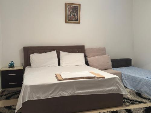 a bedroom with a bed with a tray on it at Guri Guest House in Pogradec