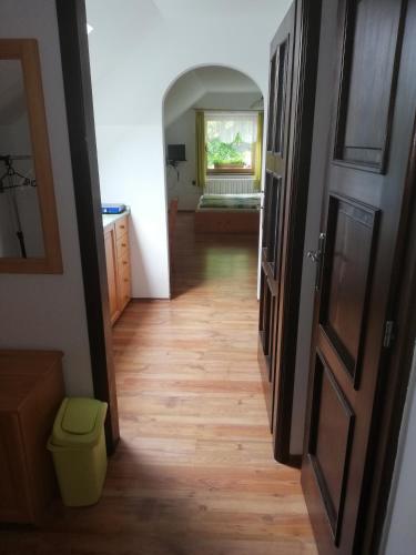 a hallway leading into a room with a door at Apartmány Pod Kapličkou in Stachy