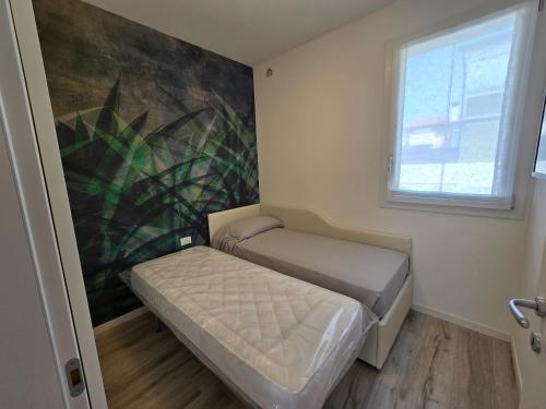 Katil atau katil-katil dalam bilik di Home23Jesolo! Beach, Parking and Bikes included