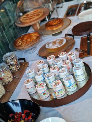 a table topped with lots of food and desserts at Como Hills in Como