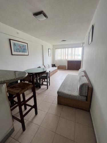 a living room with a couch and a table at Apartamento Caribbean Tucacas in Tucacas