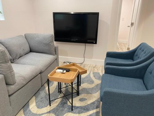 a living room with two couches and a tv at Charming 3BR 1BA Apt in Mission in San Francisco