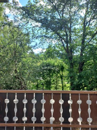 a wooden fence with trees in the background at Ferienwohnung Detox in Payerbach