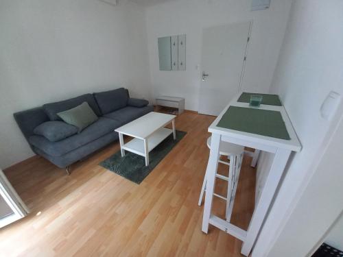 a living room with a couch and a table at Ferienwohnung Detox in Payerbach