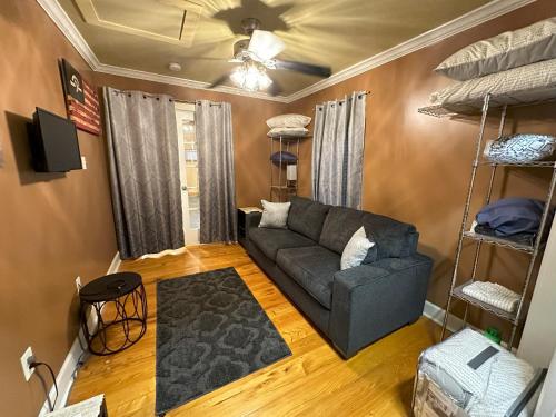 a living room with a couch and bunk beds at Chez Le Fleur in Scott