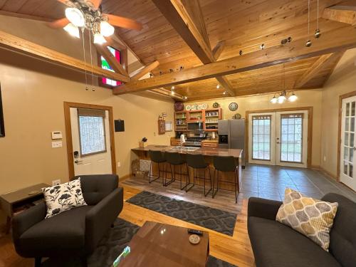 a living room with a couch and a table at Chez Le Fleur in Scott