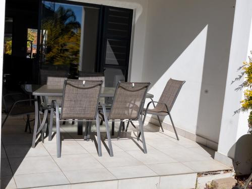 a table and chairs sitting on a patio at The Blyde Crystal lagoon Pretoria in Pretoria