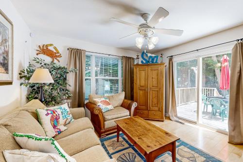 a living room with a couch and a table at Savannahs Landing - 6 Mary Elizabeth in Ocean View