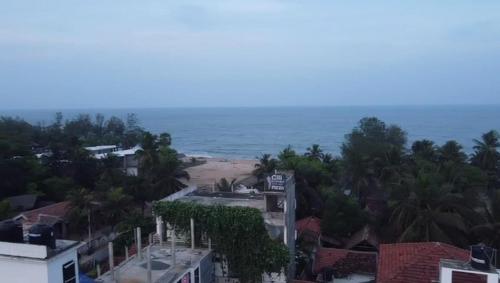 an aerial view of a beach and the ocean at Crystal Bay in Arugam Bay