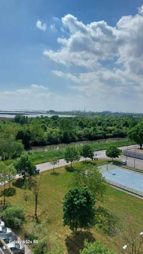 an aerial view of a park with a tennis court at ## Punto FM## in Campalto