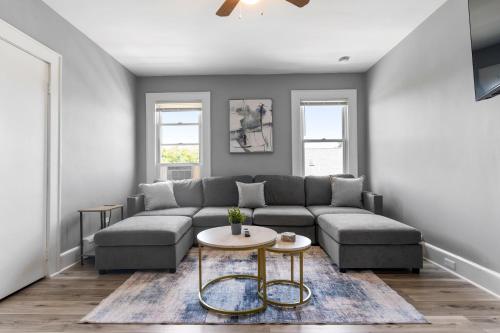 a living room with a couch and a table at 2BR Apartment Near Downtown Stamford I Pets OK in Stamford