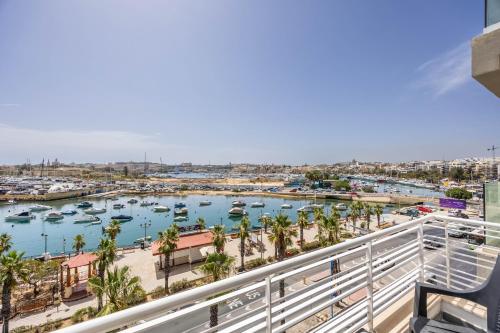 a view of a harbor with boats in the water at NEW Duplex penthouse w breathtaking views by SF HOMES in Il-Gżira