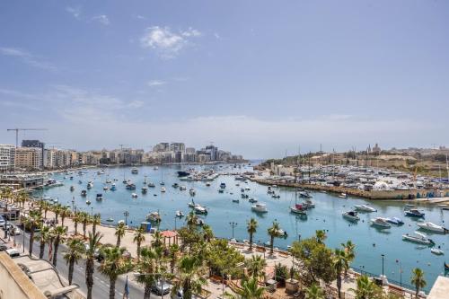 a view of a harbor with boats in the water at NEW Duplex penthouse w breathtaking views by SF HOMES in Il-Gżira