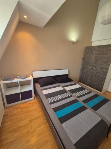 a bedroom with a large bed in a room at VORTEX Apartment Skopje in Skopje