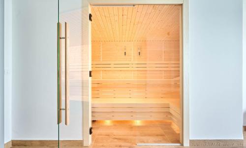 a sauna is shown through a glass door at Aminess Style Glamping Villas & Holiday Homes Atea in Njivice