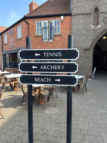 a street sign in front of a building at Sunrise Cove, The Bay, Filey in Filey