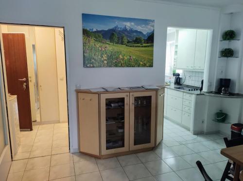 a kitchen with an island in the middle of a room at Wildente am See in Maishofen