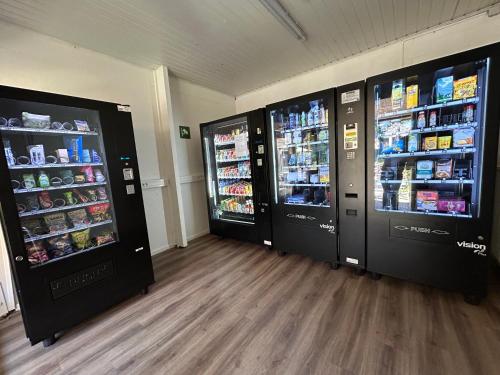 two refrigerators in a room with food and drinks at Chalet Durbuy 123 in Durbuy