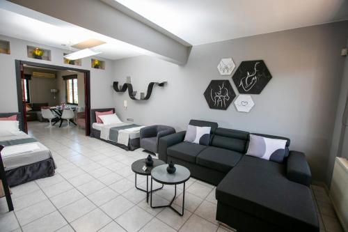 a living room with a couch and a bed at CASTLE VIEW luxury apartment with Free Private Parking in Kavala