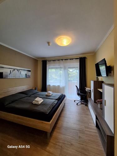 Postel nebo postele na pokoji v ubytování AlpenKlub Hotel