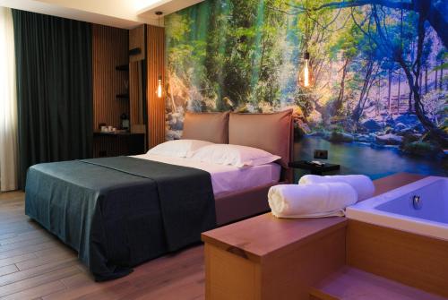 a bedroom with a bed and a painting on the wall at Mazzini House B&B in Sassari