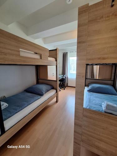 Postel nebo postele na pokoji v ubytování AlpenKlub Hotel