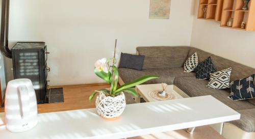 a living room with a couch and a table at Apartman Lili in Knin