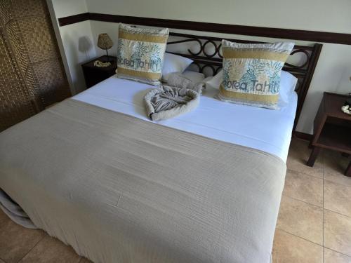 Cama o camas de una habitación en Fare Le Flamboyant
