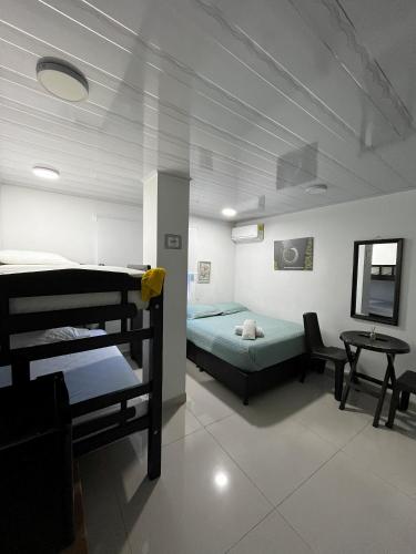 Giường trong phòng chung tại ESTRELLA DEL MAR