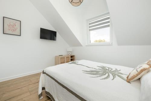 TV a/nebo společenská místnost v ubytování Akwamaryn Apartamenty