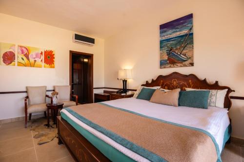 Postel nebo postele na pokoji v ubytování Grand Waha Resort