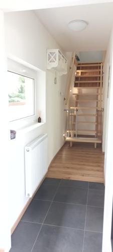 a hallway with a staircase in a house at Randy's House Plzeň in Plzeň