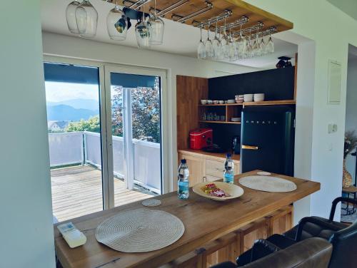 a kitchen with a table with two bottles of water on it at Penthouse am Golfplatz, Nähe RedBull Ring in Trofaiach