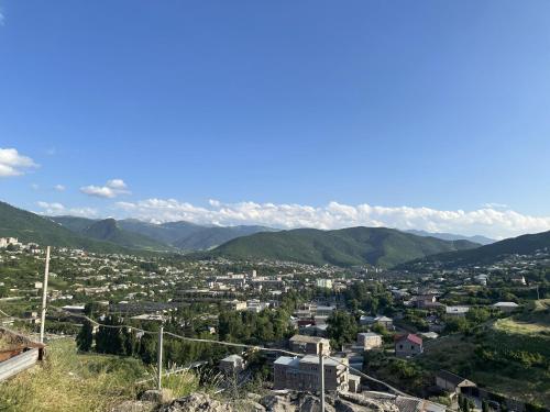 a view of a city with mountains in the background at Tevra Hotel, Top of the Mountain, Camping, Nature, Ijevan, Dilijan in Ijevan