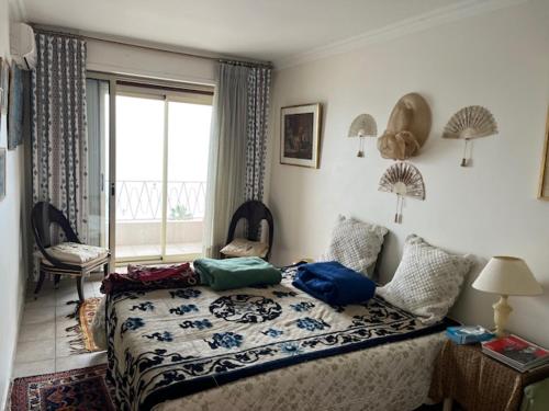 Postel nebo postele na pokoji v ubytování Jane de Cannes