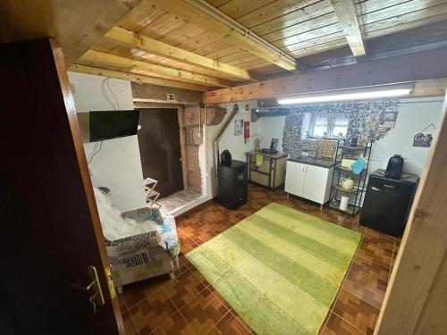 an overhead view of a living room with a kitchen at Casa da Eira - Portugal Profundo in Vila Pouca de Aguiar